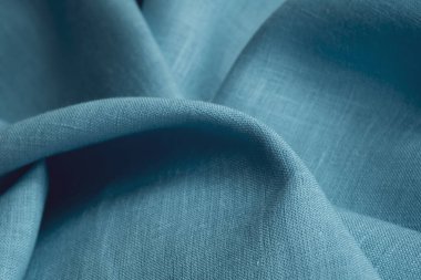 Keten kumaş, mavi arka plan. Yumuşak keten mavi kumaş dokusu. Kumaş kaplama. Sığ noktalı Macro