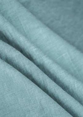 Keten kumaş, mavi arka plan. Yumuşak keten mavi kumaş dokusu. Kumaş kaplama. Sığ noktalı Macro