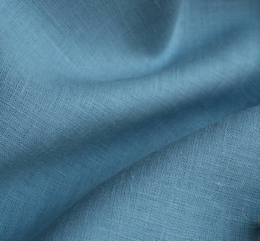 Keten kumaş, mavi arka plan. Yumuşak keten mavi kumaş dokusu. Kumaş kaplama. Sığ noktalı Macro
