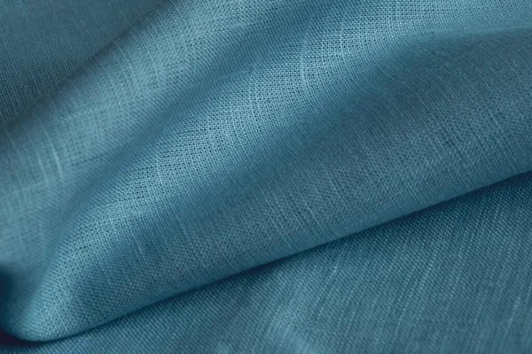 Keten kumaş, mavi arka plan. Yumuşak keten mavi kumaş dokusu. Kumaş kaplama. Sığ noktalı Macro