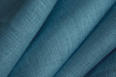 Keten kumaş, mavi arka plan. Yumuşak keten mavi kumaş dokusu. Kumaş kaplama. Sığ noktalı Macro