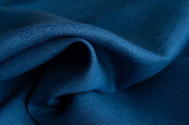 Keten kumaş, mavi arka plan. Yumuşak keten mavi kumaş dokusu. Kumaş kaplama. Sığ noktalı Macro