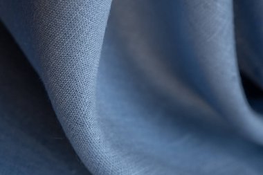 Keten kumaş, mavi arka plan. Yumuşak keten mavi kumaş dokusu. Kumaş kaplama. Sığ noktalı Macro