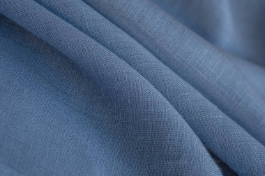 Keten kumaş, mavi arka plan. Yumuşak keten mavi kumaş dokusu. Kumaş kaplama. Sığ noktalı Macro