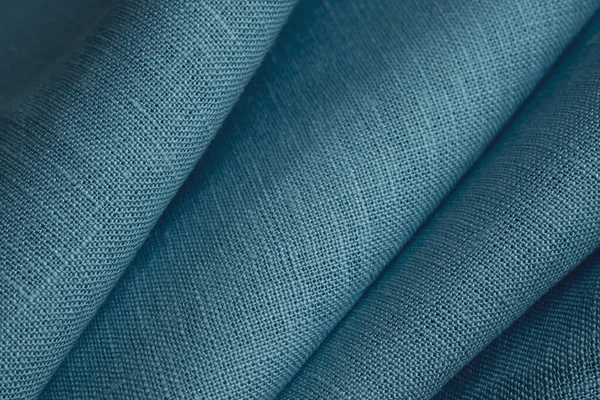 リネン生地 青の背景 柔らかいリネンブルーの生地の質感 テクスチャ加工生地の背景 浅いドーフのマクロ — ストック写真