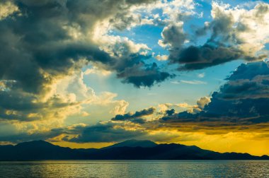 Bright blue and orange sunset sky on the sea