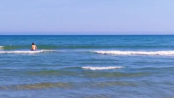 Boy Entering Sea View Back Blue Sea Sandy Beach Mediterranean — ストック動画