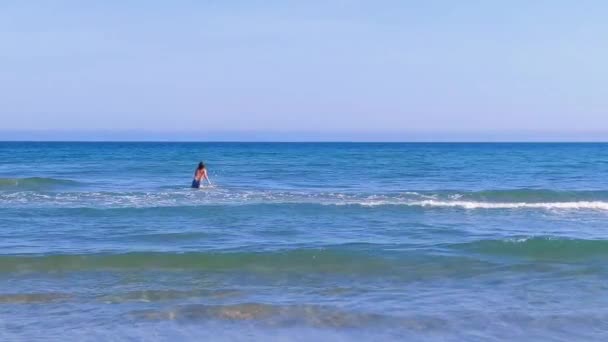 Boy Entering Sea View Back Blue Sea Sandy Beach Mediterranean — ストック動画