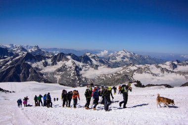 Mount Elbrus, Kabardino-Balkaria, Russia - July, 29, 2015: Group of climbers climbing mountain peak Elbrus. International Mountaineering Day - 8 August. International Mountain Day - 11 December