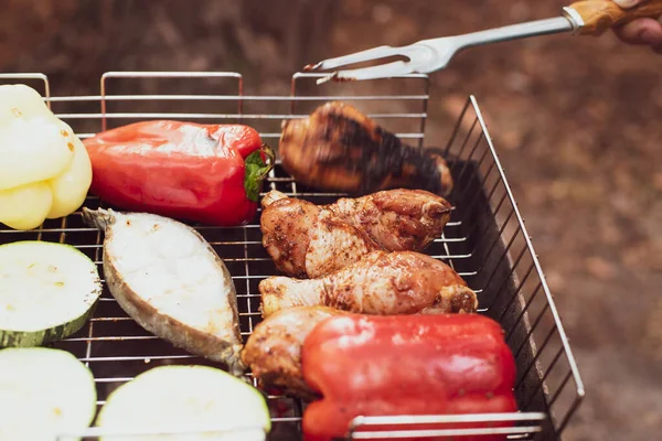 Outdoor barbeque grill. Summer picnic. Outdoor recreation. Food cooked over a campfire