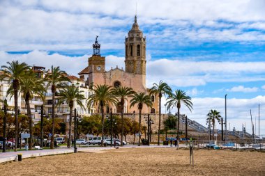 Views of Church of St. Bartholomew and Santa Tecla Sitges, Catalonia, Spain. Landmarks of Sitges. Winter in the Mediterranean clipart