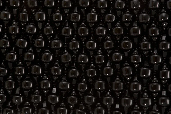 Vertical plane of black beads — Stock Photo, Image