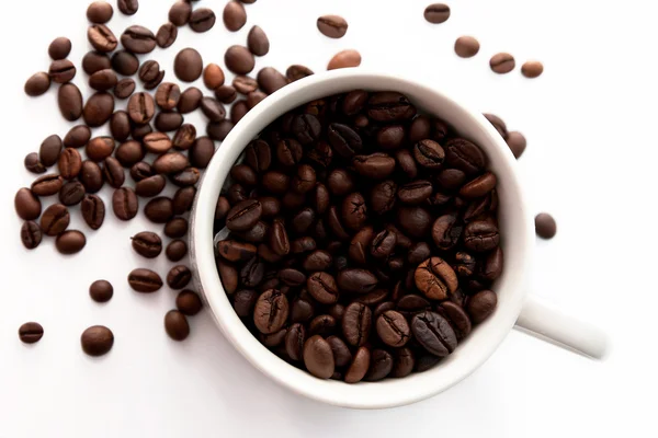 Granos de café y taza de café —  Fotos de Stock