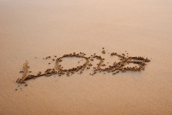 Wort Liebe im Sand — Stockfoto