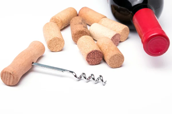 Bottle of red wine, corks and corkscrew — Stock Photo, Image