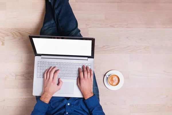 Man Wearing Jeans Sitting Wooden Floor Holding Laptop White Empty — Stock Photo, Image