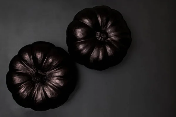 Two Black Pumpkins Black Background Stylish Halloween Decor Top View — Stockfoto