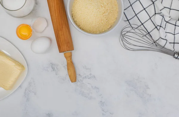 Ingredients and tools for baking, flat lay on marble table