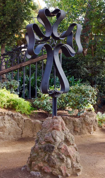 Cross iron in park city Barcelona designed by Antoni Gaudi — Stock Photo, Image