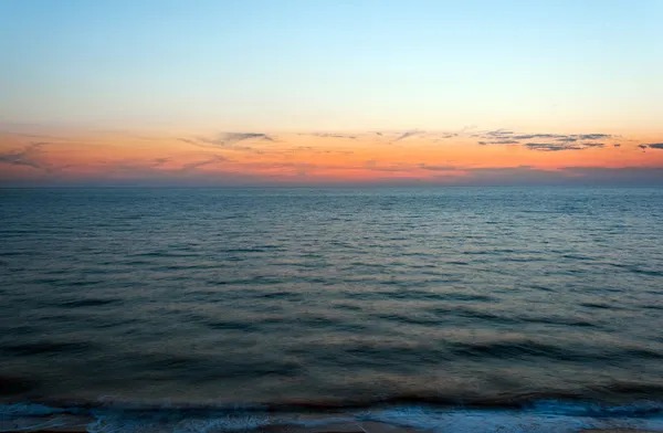 日落在海海滩蓝色天空 — 图库照片