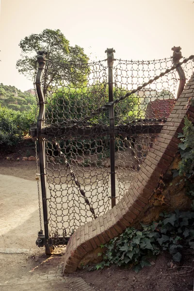 Ancient gates in the park Guell , Barcelona. Catalonia. — Stock Photo, Image