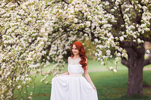 Portrait of beautiful woman in white dress