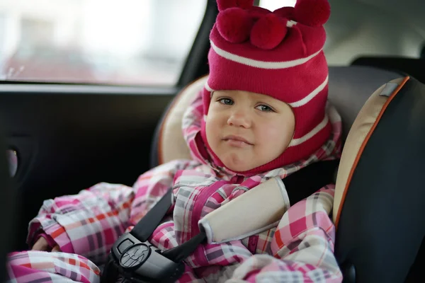 Sad baby in car seat — Stock Photo, Image