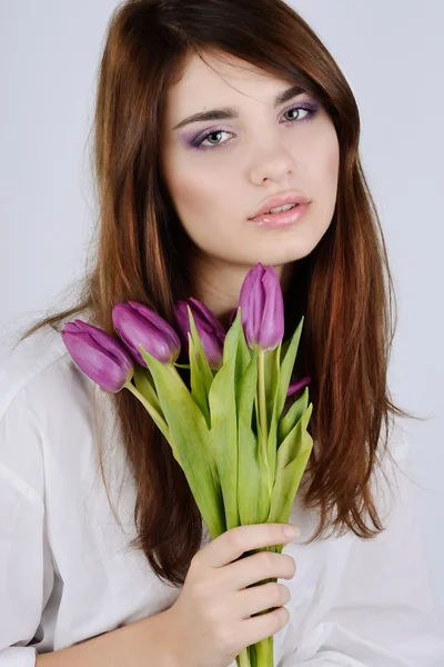 Tender girl with tulips — Stock Photo, Image