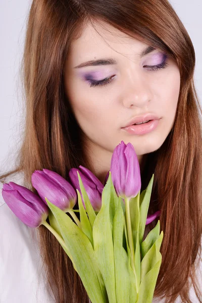 Menina com tulipas — Fotografia de Stock