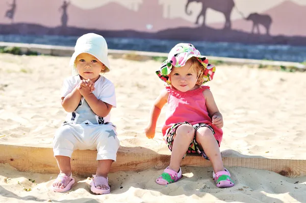 Girls in sand — Stock Photo, Image