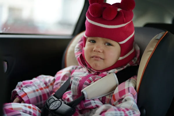 Sad baby in car seat — Stock Photo, Image