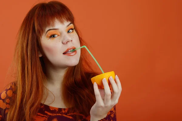 Girl with orange — Stock Photo, Image