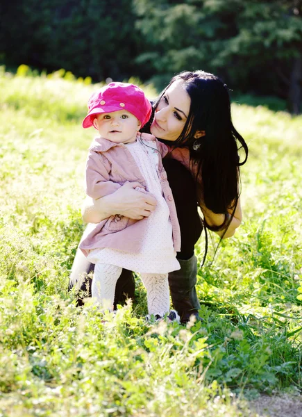 Mother and daughter on the meadow — Stock Photo, Image