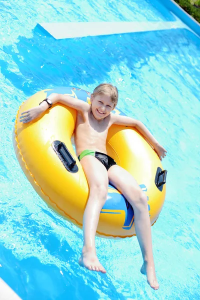 Happy boy in pool — Stock Photo, Image