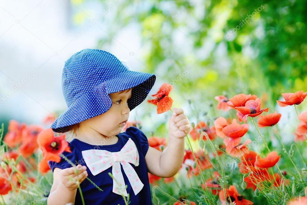 toddler gathering poppies