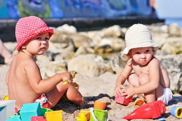 Baby girls with sand — Stock Photo, Image
