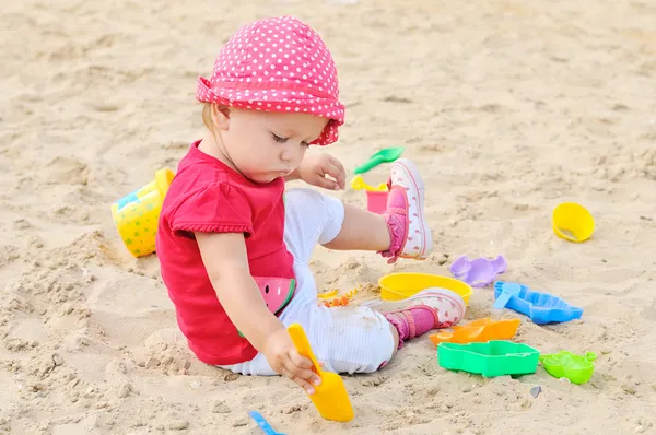 Girl playing in sand Royalty Free Stock Images