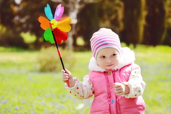 Toddler with windmill — Stock Photo, Image