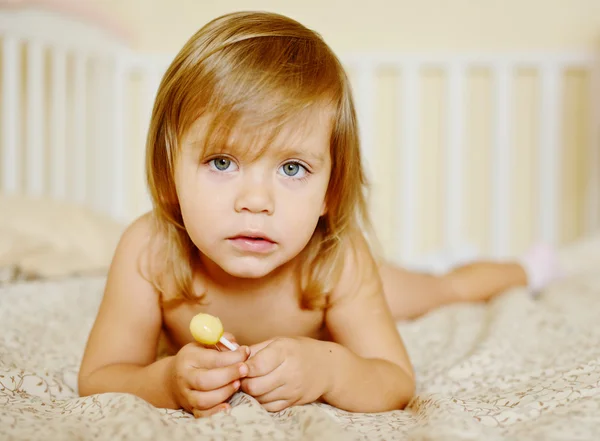 Toddler with lollipop — Stock Photo, Image