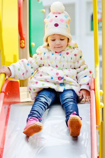 Toddler on slide — Stock Photo, Image