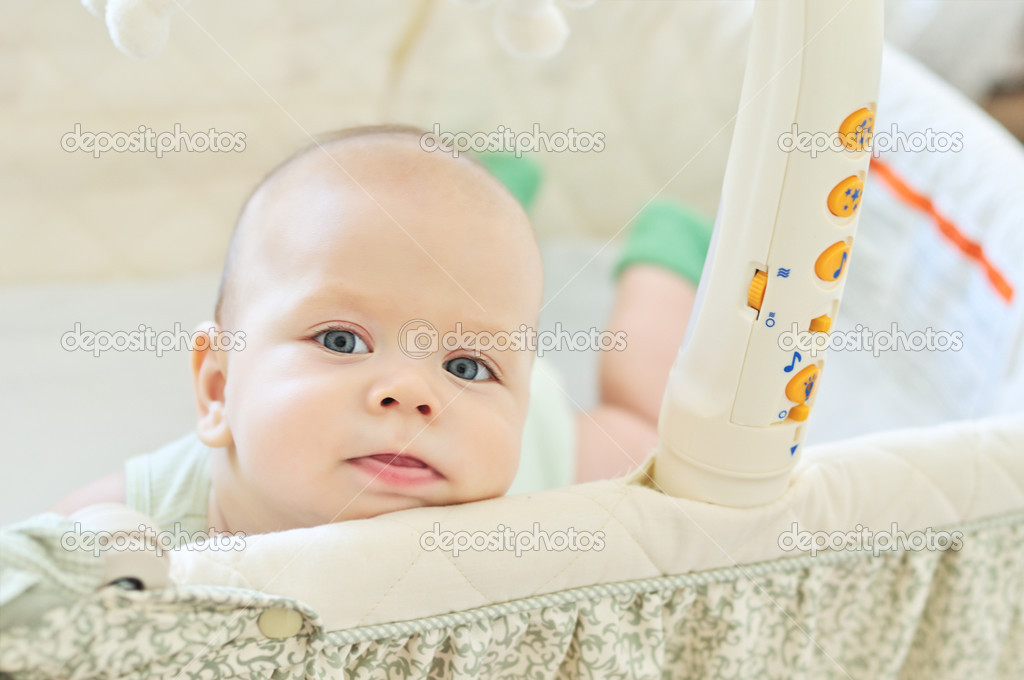Baby in crib Stock Photo by ©Reanas 48870795