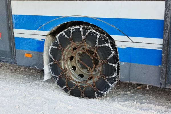 Snow winter chains on tyre of car — Stock Photo, Image