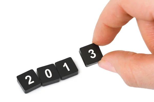 Числа 2013 и рука — стоковое фото