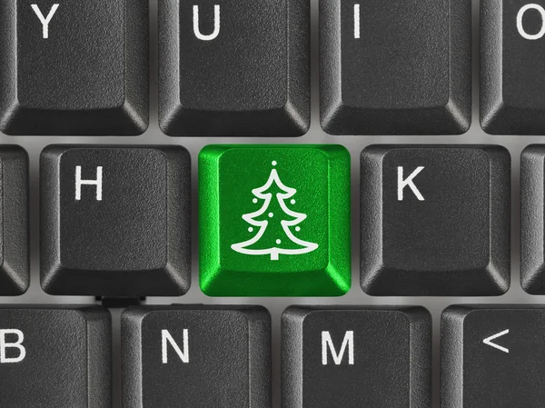 Teclado de computador com chave de árvore de Natal — Fotografia de Stock