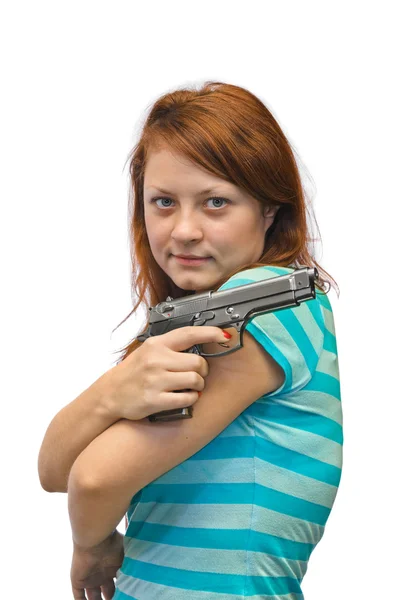 Молодая женщина и пистолет — стоковое фото
