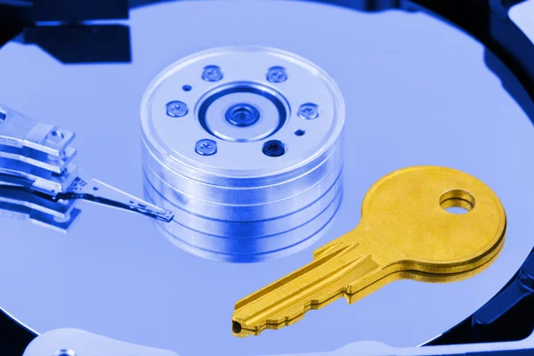 Key on computer hdd disk Stock Picture