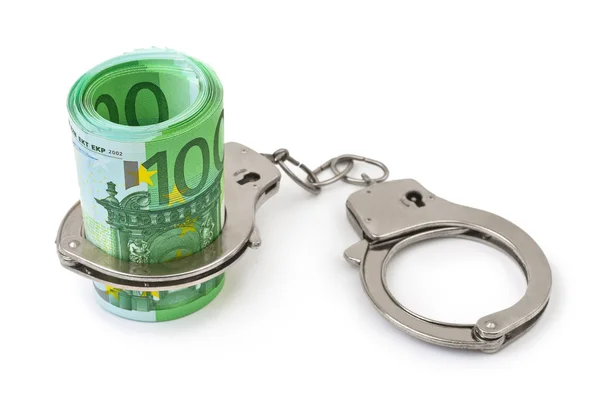 Money and handcuffs — Stockfoto