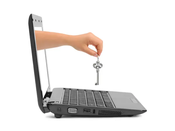 Hand with key and notebook — Stock Photo, Image