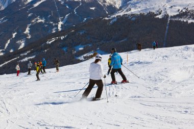 Skiers at mountains ski resort Bad Gastein Austria clipart