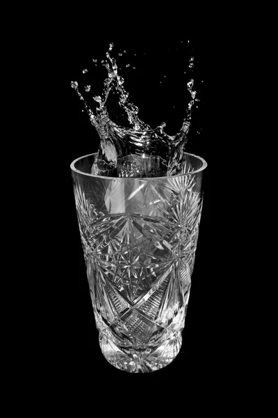 Glass of water and splashes — Stock Photo, Image